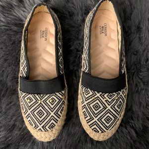 Black/white/tan geometric flats